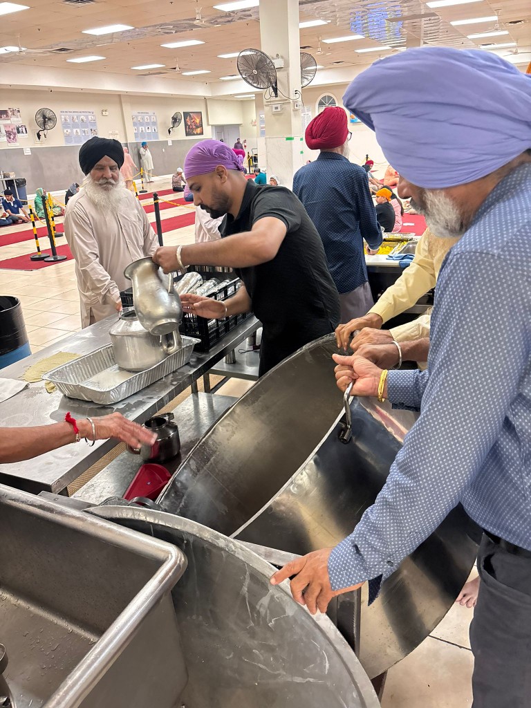 Volunteers serving food at a community kitchen