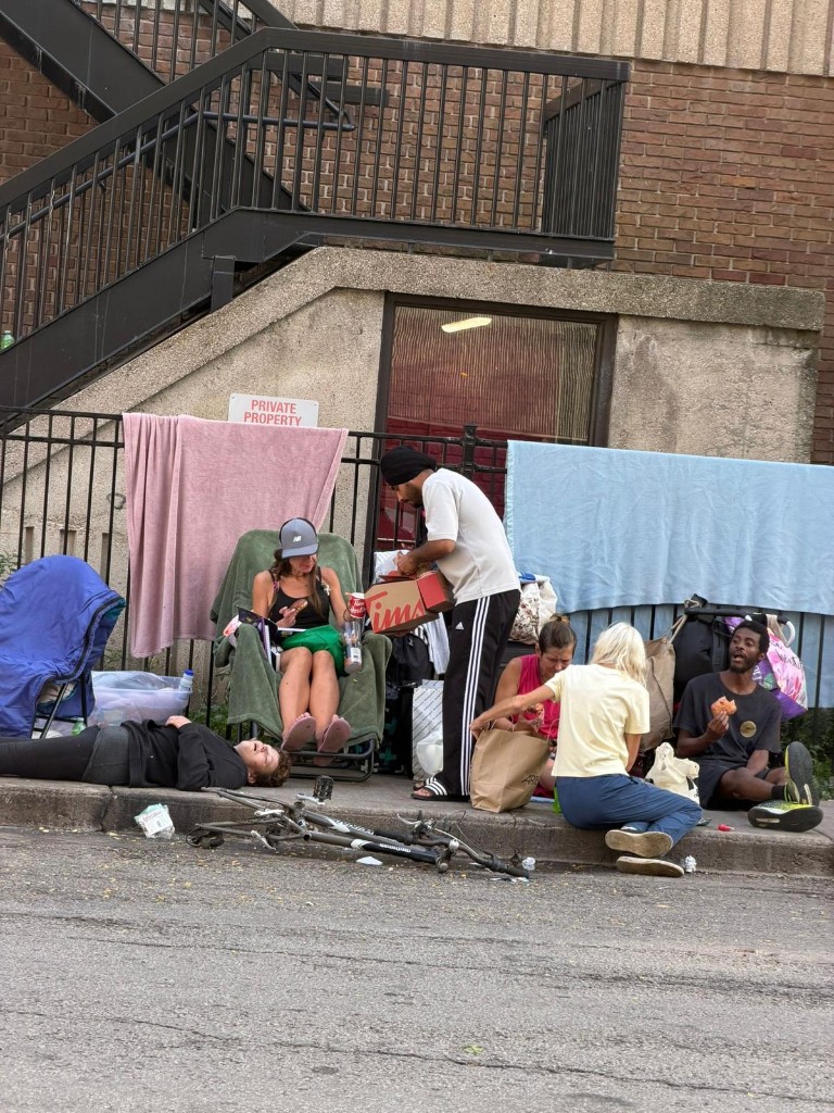Sharing meals and essentials with community members on the street